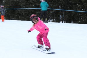 Iron County Michigan Ski Brule little girl snowboarding
